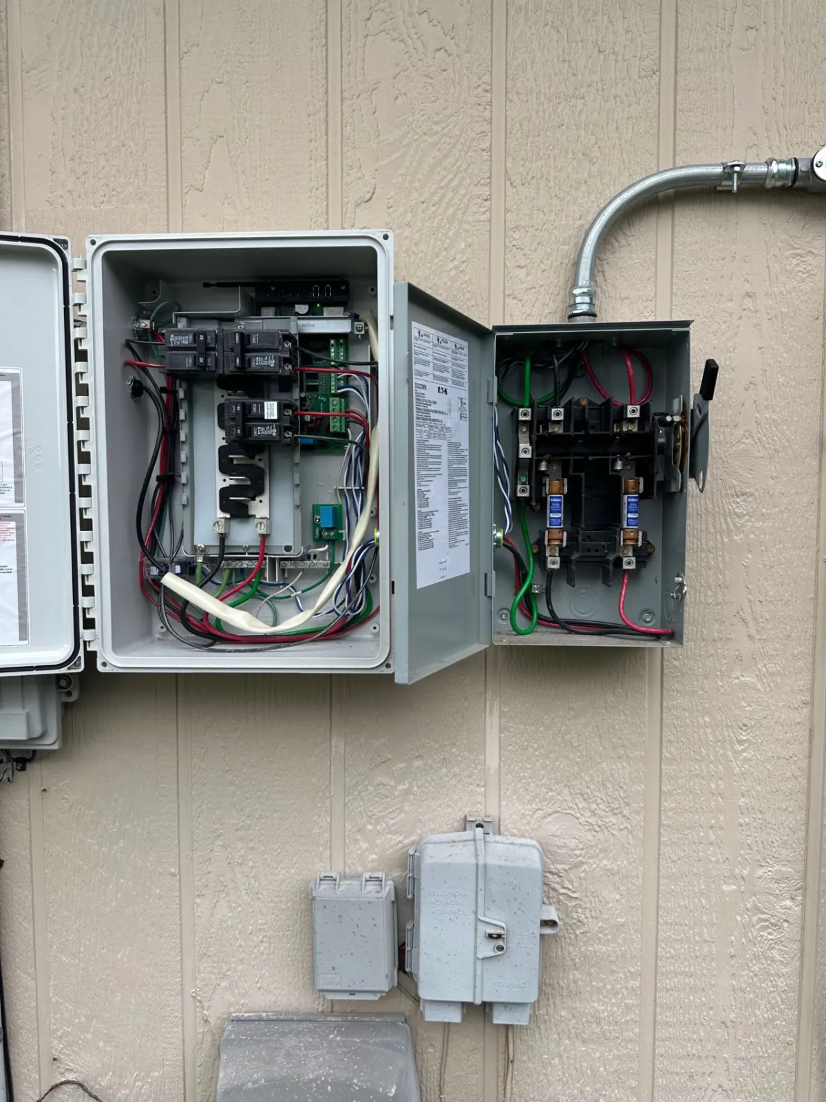 The combiner panel and AC disconnect both open during the audit, showing the wiring and fusing between the solar array and the home's main panel